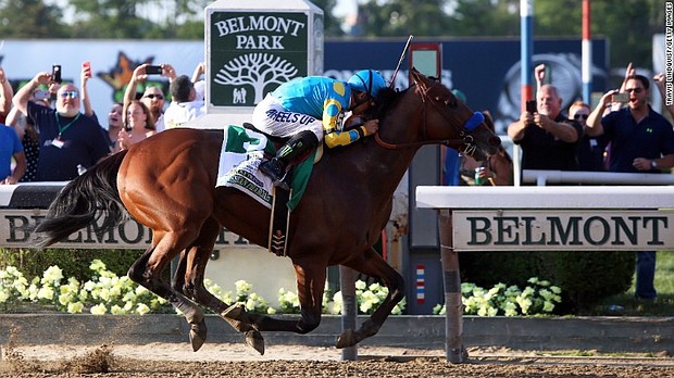 Kentucky Derby and Preakness Stakes winner American Pharoah wins the 147th running of the Belmont Stakes