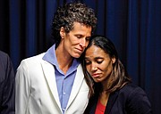 Andrea Constand, 45, left, embraces prosecutor Kristen Feden during a news conference April 26 after a jury found Bill Cosby guilty of drugging and raping her. 
