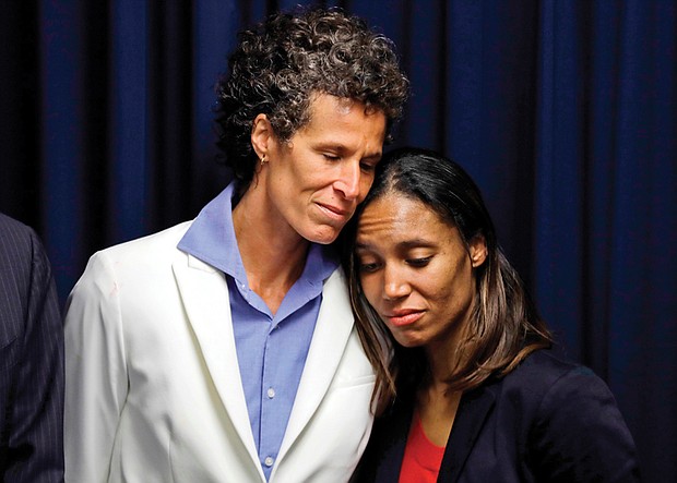 Andrea Constand, 45, left, embraces prosecutor Kristen Feden during a news conference April 26 after a jury found Bill Cosby guilty of drugging and raping her. 