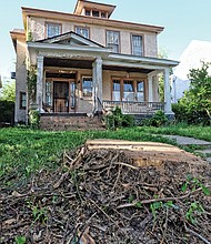 Cityscape // This stump,  left, is all that remains of the dying sycamore that once stood, above, in front of Spencer Turner’s North Side home. The city Department of Public Works authorized the removal of the city tree last Friday from the property in the 100 block of West Lancaster Road. 