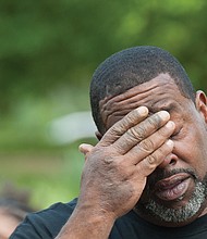 Holding on to hope // Brian Hunt, the father of Delecia Waddy, 24, who has been missing from Bowling Green since March 9, 2017, tries to gather himself, below right, during an emotional Richmond Missing Persons Day Rally last Saturday at Chimborazo Park. 
