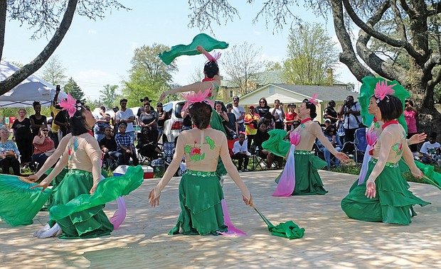 Members of the Red Silk Performing Arts Chinese Dancers, showcase a tribute to the lotus flower. Gospel singer-songwriter and award winner Earnest Pugh also perfomed, along with J-Unity Outreach Choir.
