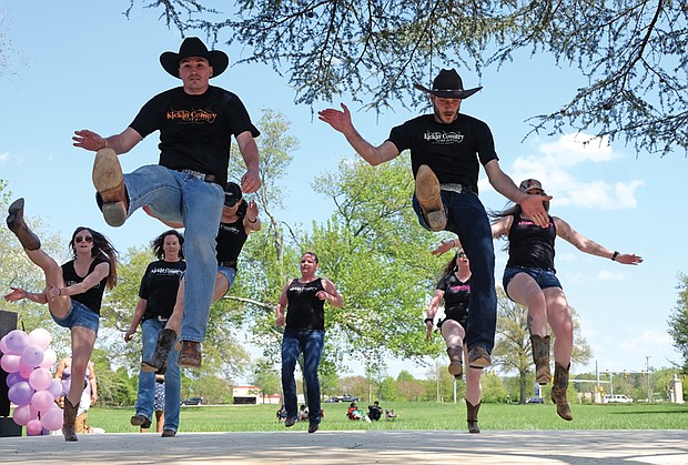 The free event, held on the grounds at St. Joseph’s Villa in North Side, featured all forms of music and dance. Above right, high steppers from Kickin’ Country show off their moves