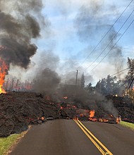 Lava from fissure 7 slowly advanced to the northeast on Hookapu Street in Leilani Estates subdivision on May 6, 2018.