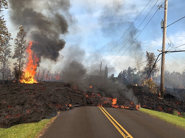 Lava from fissure 7 slowly advanced to the northeast on Hookapu Street in Leilani Estates subdivision on May 6, 2018.