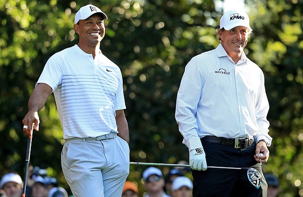 Tiger Woods (left) and Phil Mickelson played a surprise practice round together ahead of the Masters.