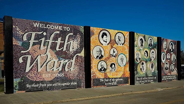 The Fruits of the Fifth Ward mural at the corner of Lyons Avenue and Schwartz Street created by Reginald Adams with students from Phyllis Wheatley High School in 2006 with support from the History Channel. The Fruits of the Fifth Ward depicts portraits of 21 people who lived in and had an impact on the community. Mural portraits include Senator Barbara Jordan and Representative Mickey Leland, boxer George Foreman and blues musician Lightnin’ Hopkins.