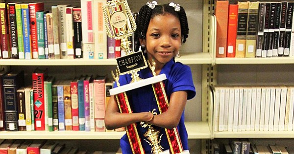 Anaya Ellick holding her award