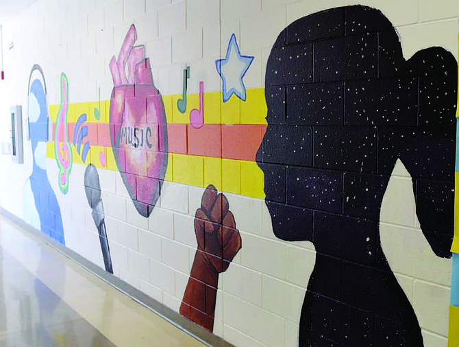 A mural, titled The Art of Music, was a collaborative effort between Ricardo Gonzalez, an artist and resident of Blue Island, students from Kellar Middle School in Robbins, Metropolitan Family Services, and the Blue Island-Robbins Neighborhood Network.