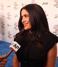 Salma Hayek wants to close the pay gap in Hollywood, but she acknowledges that it's going to take a lot of work to make that happen.