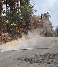 Toxic sulfur dioxide seeps out of the street in Leilani Estates, Hawaii.