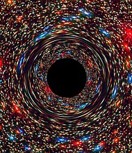 Astronomers have found the fastest-growing black hole ever seen in the universe, and they're calling this one a monster with an appetite. It's growing so fast it can devour a mass the size of the sun every two days.  CREDIT: NASA/ESA/D. Coe., J. Anderson, and R. Van Der Marel (STSCI)