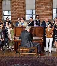 The Houston Chamber Choir, led by Artistic Director Robert Simpson, announces an exciting, diverse season for 2018-19. Pictured here is Simpson at the piano with members of the Choir.
