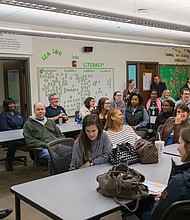 Above, Superintendent Jason Kamras leads an early morning discussion with teachers and staff at Broad Rock Elementary School on Feb. 9, assuring the group that he will stay in the job until his contract ends in 2021. Later that morning.