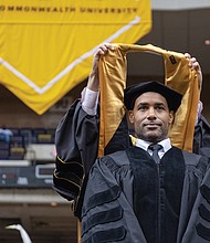 Actor Boris Kodjoe, a Virginia Commonwealth University alumnus and athletics hall of famer, receives an honorary degree after delivering the commencement speech during Saturday’s ceremony.