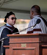 Raymond H. Boone Jr., left, Free Press vice president for new business development, accepts an honorary degree granted posthumously by Virginia Union University to his father, Raymond H. Boone Sr., the founder and late publisher of the Free Press. Presenting the degree are, center, Dr. W. Franklyn Richardson, chair of the VUU Board of Trustees, and VUU President Hakim Lucas.
