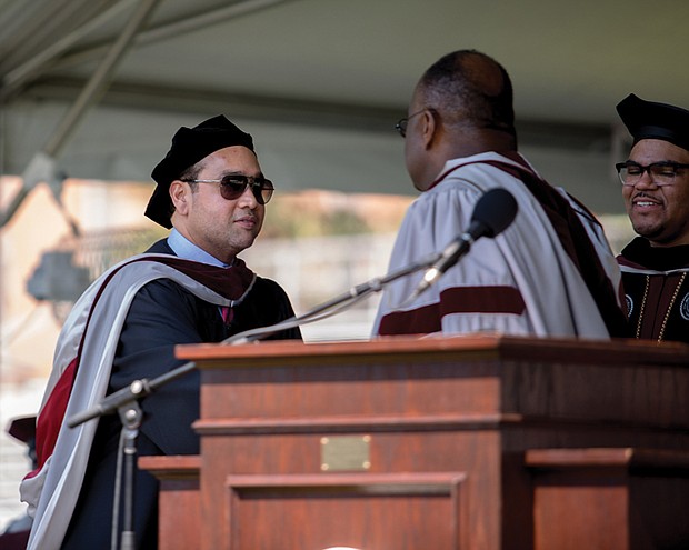 Raymond H. Boone Jr., left, Free Press vice president for new business development, accepts an honorary degree granted posthumously by Virginia Union University to his father, Raymond H. Boone Sr., the founder and late publisher of the Free Press. Presenting the degree are, center, Dr. W. Franklyn Richardson, chair of the VUU Board of Trustees, and VUU President Hakim Lucas.