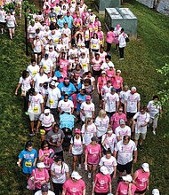 Racing for a cure //
Thousands of people donned sneakers and pink T-shirts for last Saturday’s 21st Annual Susan G. Komen Race For The Cure to raise money for breast cancer. The event featured a competitive run and a recreational run - walk across the James River at the T. Tyler Potterfield Memorial Bridge, along with a cancer survivors’ parade and an awards ceremony. Here, participants walk on Brown’s Island along the canal.