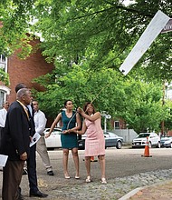 Singleton honored // Christopher Smith

Rose Singleton, right, unveils the honorary street sign renaming the 2700 block of East Grace Street after her late husband, Oliver R.H. Singleton, president and chief executive officer of the Metropolitan Business League. Richmond City Council voted in February to authorize the sign to honor Mr. Singleton’s role as an advocate for minority-owned and small business development. Dozens of family members and friends were on hand for the ceremony Tuesday. Helping to remove the sign are the Singletons’ daughter, Christine, and son, Oliver. 
