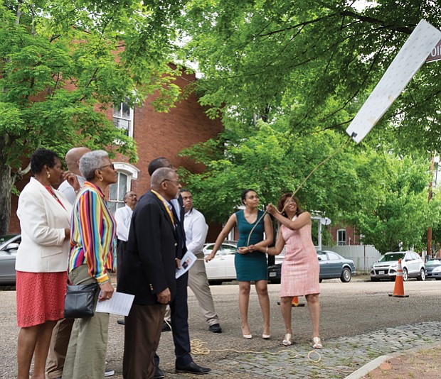 Singleton honored // Christopher Smith

Rose Singleton, right, unveils the honorary street sign renaming the 2700 block of East Grace Street after her late husband, Oliver R.H. Singleton, president and chief executive officer of the Metropolitan Business League. Richmond City Council voted in February to authorize the sign to honor Mr. Singleton’s role as an advocate for minority-owned and small business development. Dozens of family members and friends were on hand for the ceremony Tuesday. Helping to remove the sign are the Singletons’ daughter, Christine, and son, Oliver. 
