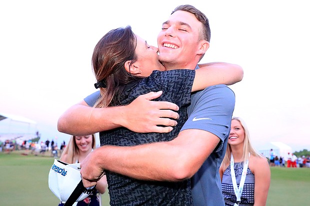 	Aaron Wise celebrates with his mother Karla Kane after winning the AT&T Byron Nelson.
