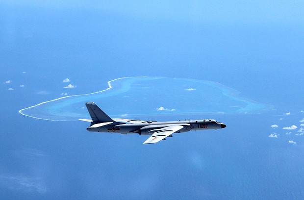 A July 2016 file photo shows a Chinese H-6K bomber patrolling islands and reefs, including Huangyan Island in the South China Sea.