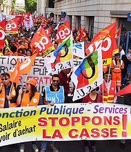 Protesters march in Montpellier on Tuesday, calling for public sector protection.