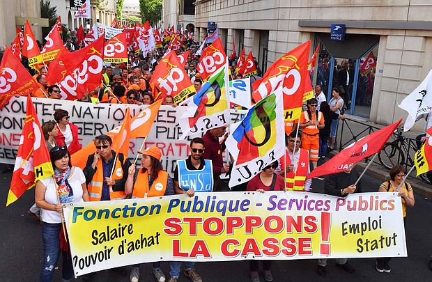 Protesters march in Montpellier on Tuesday, calling for public sector protection.