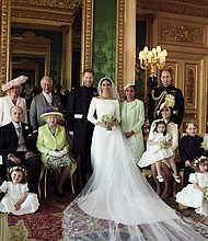 The new royal family as seen in the official wedding photograph taken in the Green Drawing Room at Windsor Castle and released Monday by the newlyweds. Surrounding the newlyweds, Prince Harry and Meghan Markle, the Duke and Duchess of Sussex, they are back row, from left: Jasper Dyer; Camilla, the Duchess of Cornwall; Prince Charles, the Prince of Wales, the groom’s father; Doria Ragland, the bride’s mother; and Prince William, the Duke of Cambridge, the groom’s brother. Middle row, from left: Brian Mulroney; Prince Philip, the Duke of Edinburgh, the groom’s grandfather; Queen Elizabeth II, the groom’s grandmother; Catherine, the Duchess of Cambridge, with Princess Charlotte on her lap; Prince George; Rylan Litt; and John Mulroney. Front row, from left: Ivy Mulroney, Florence van Cutsem; Zalie Warren; and Remi Litt.
