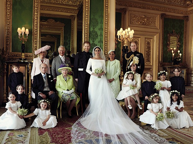 The new royal family as seen in the official wedding photograph taken in the Green Drawing Room at Windsor Castle and released Monday by the newlyweds. Surrounding the newlyweds, Prince Harry and Meghan Markle, the Duke and Duchess of Sussex, they are back row, from left: Jasper Dyer; Camilla, the Duchess of Cornwall; Prince Charles, the Prince of Wales, the groom’s father; Doria Ragland, the bride’s mother; and Prince William, the Duke of Cambridge, the groom’s brother. Middle row, from left: Brian Mulroney; Prince Philip, the Duke of Edinburgh, the groom’s grandfather; Queen Elizabeth II, the groom’s grandmother; Catherine, the Duchess of Cambridge, with Princess Charlotte on her lap; Prince George; Rylan Litt; and John Mulroney. Front row, from left: Ivy Mulroney, Florence van Cutsem; Zalie Warren; and Remi Litt.
