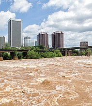 
The waters of the James River rage through Richmond on Monday, fueled by fives days of heavy rain last week. During the weekend, the river crested 3 feet above the 8-foot flood stage in Downtown before returning to its banks this week. 
The Richmond area got soaked, with nearly 8.5 inches of rain between May 15 and May 19, according to the National Weather Service. The heaviest rain hit Friday, May 18, when 3.86 inches fell — a record for that day. The downpour created flash floods that trapped some motorists, toppled trees and temporarily cut off power to thousands of homes and businesses. That downpour followed the 2.67 inches that fell May 17, also a daily record.
Ahead, more rain is predicted for the holiday. The forecast calls for sunshine Friday, May 25, with cloudy skies moving in for the weekend. A chance of thunderstorms is expected Saturday, May 26, with cloudy skies Sunday, May 27, and continued cloudy skies and a chance of light rain on Memorial Day, Monday, May 28. Highs are forecast to be the 80s Saturday and Sunday, dipping into the upper 70s on the holiday. 