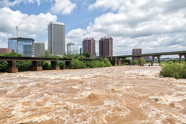 
The waters of the James River rage through Richmond on Monday, fueled by fives days of heavy rain last week. During the weekend, the river crested 3 feet above the 8-foot flood stage in Downtown before returning to its banks this week. 
The Richmond area got soaked, with nearly 8.5 inches of rain between May 15 and May 19, according to the National Weather Service. The heaviest rain hit Friday, May 18, when 3.86 inches fell — a record for that day. The downpour created flash floods that trapped some motorists, toppled trees and temporarily cut off power to thousands of homes and businesses. That downpour followed the 2.67 inches that fell May 17, also a daily record.
Ahead, more rain is predicted for the holiday. The forecast calls for sunshine Friday, May 25, with cloudy skies moving in for the weekend. A chance of thunderstorms is expected Saturday, May 26, with cloudy skies Sunday, May 27, and continued cloudy skies and a chance of light rain on Memorial Day, Monday, May 28. Highs are forecast to be the 80s Saturday and Sunday, dipping into the upper 70s on the holiday. 