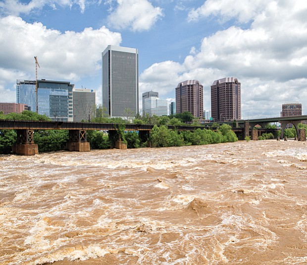 
The waters of the James River rage through Richmond on Monday, fueled by fives days of heavy rain last week. During the weekend, the river crested 3 feet above the 8-foot flood stage in Downtown before returning to its banks this week. 
The Richmond area got soaked, with nearly 8.5 inches of rain between May 15 and May 19, according to the National Weather Service. The heaviest rain hit Friday, May 18, when 3.86 inches fell — a record for that day. The downpour created flash floods that trapped some motorists, toppled trees and temporarily cut off power to thousands of homes and businesses. That downpour followed the 2.67 inches that fell May 17, also a daily record.
Ahead, more rain is predicted for the holiday. The forecast calls for sunshine Friday, May 25, with cloudy skies moving in for the weekend. A chance of thunderstorms is expected Saturday, May 26, with cloudy skies Sunday, May 27, and continued cloudy skies and a chance of light rain on Memorial Day, Monday, May 28. Highs are forecast to be the 80s Saturday and Sunday, dipping into the upper 70s on the holiday. 