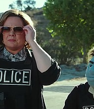 Melissa McCarthy with her puppet co-star in "The Happytime Murders."