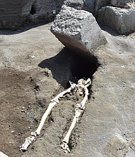 Archaeologists at Pompeii uncovered these remains of a 30-year-old man who appears to have survived the initial eruption of Vesuvius in 79 A.D., only to be killed when he was struck by a large slab of stone.