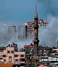 Israel has carried out dozens of airstrikes on targets in Gaza in response to what it called the biggest barrage of rocket and mortar fire from the strip since the 2014 war there.