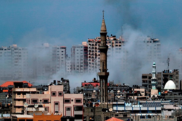 Israel has carried out dozens of airstrikes on targets in Gaza in response to what it called the biggest barrage of rocket and mortar fire from the strip since the 2014 war there.