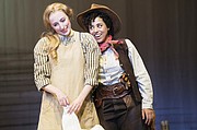 Curly (Tatiana Wechsler, right) tries to entice Laurey (Royer Bockus) into accompanying her to the box social in “Oklahoma,” a LGBTQ+ focus production now showing through Oct. 27 at the Oregon Shakespeare Festival.