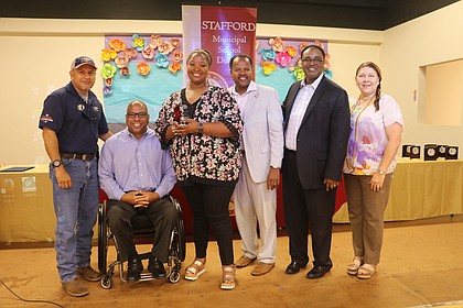 2017-18 Stafford MSD District Teacher of the Year Ashley Bratcher (pictured third from left) was congratulated by, from left, Ray Aguilar of Classic Chevrolet of Sugar Land, Stafford MSD Trustee Auturo Jackson, Bratcher, Texas State Rep. Ron Reynolds, Stafford MSD Superintendent Dr. Robert Bostic and Stafford Elementary Assistant Principal Ileana Duran-Reyes (the 2016-17 Stafford MSD District Teacher of the Year)