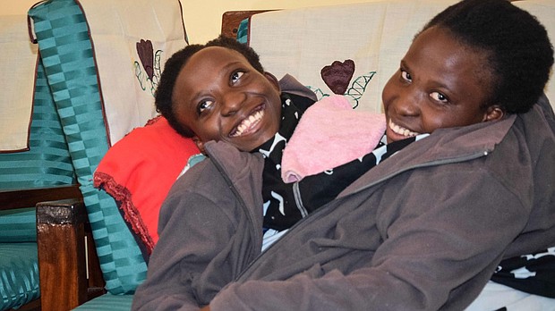 Maria, left, and Consolata Mwakikuti attended Ruaha Catholic University.