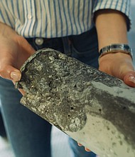 A cylinder of CarbonCure concrete after undergoing a strength test.