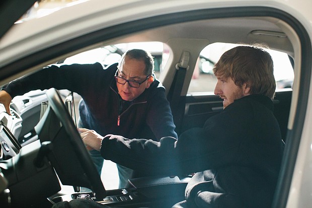 Luminar CEO Austin Russell, right, works with his co-founder Jason Eichenholz.