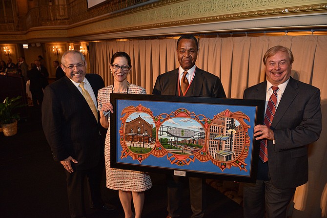 Steven Davis, chairman of The Will Group, Chicago, was presented with the “Transformation” award at the 2018 ComEd Diverse Supplier Awards in recognition of his company’s community commitment and  role in smart LED streetlight deployment throughout the Chicago area.  Steve is pictured above with (l-r) ComEd senior vice president of governmental and external affairs Fidel Marquez; Anne Pramaggiore, CEO, Exelon Utilities; and Terence R. Donnelly, president and COO, ComEd.  He was presented with a painting of Chicago’s South Side neighborhood of Bronzeville where ComEd is leveraging smart grid technology to create a Community of the Future.
