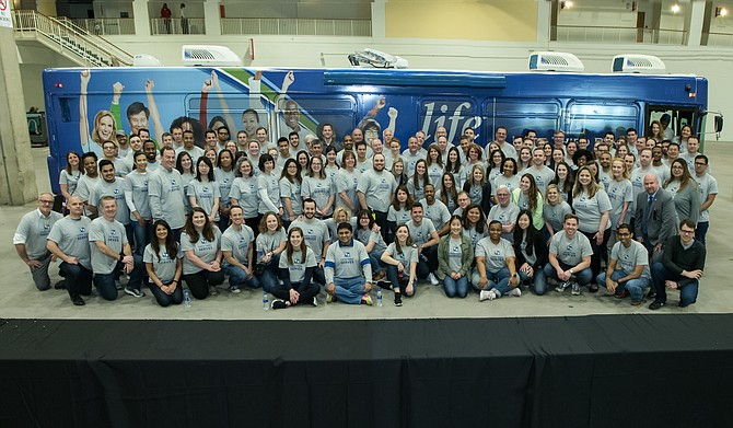 Hundreds of Fifth Third Bank employees spent the day volunteering at local food pantries. Hundreds more (in photo) spent the day assembling thousands of backpacks of food that were later given to Chicago school children who face food insecurities.