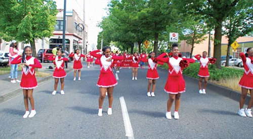 King Middle School Lions Drill Team marches down Northeast Martin Luther King Jr. Blvd for the annual Juneteenth celebration.