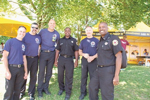 Local firefighters Brent Sheldon (from left), Eric Mann, Damon Simmons, Sultan Shabazz, Pete Straub, and Ted Mayes, enjoy the festivities.