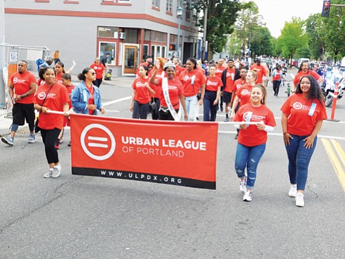 A large group represents the Urban League of Portland at Saturday’s parade.