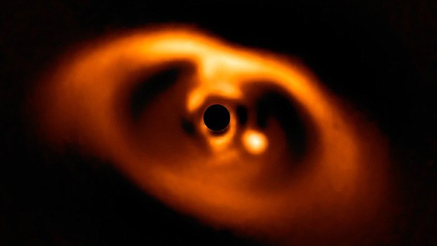 This is the first clear image of a planet caught in the act of formation around the dwarf star PDS 70.  Credit: European Southern Observatory/ESO/A. Muller Et Al.