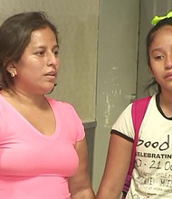 Perla De Velasquez and her daughter, Yoselin, hold hands after a tearful reunion at LAX on July 1, 2018. They had been separated by federal immigration officials for more than a month, according to a lawsuit filed by De Velasquez.