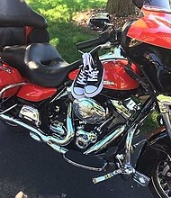 Dennis Wright asked everybody to buy shoes for children rather than flowers for his service.